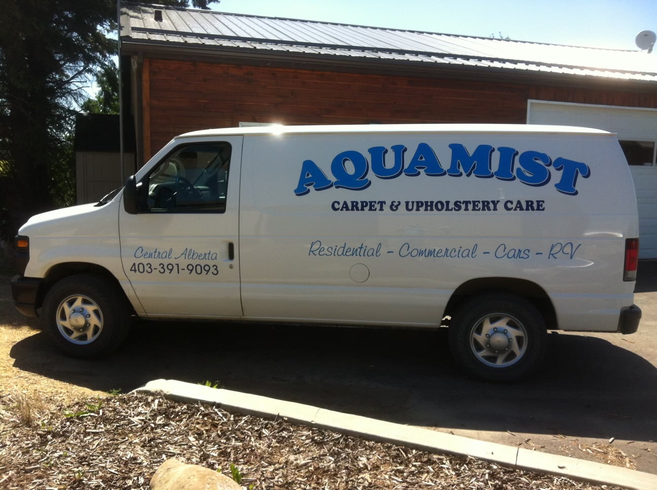 AquaMist Carpet and Upholstery Care cleaning service van
