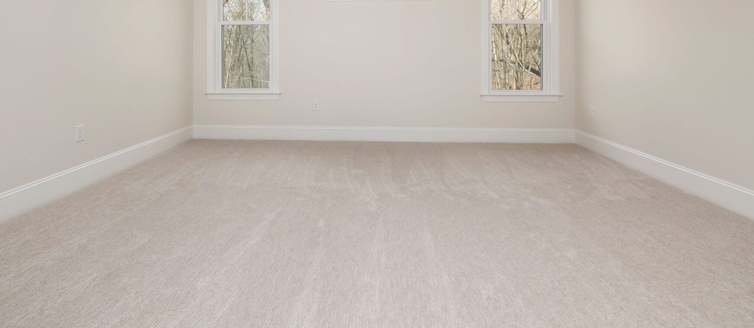 Freshly cleaned carpet in an empty room in Penhold